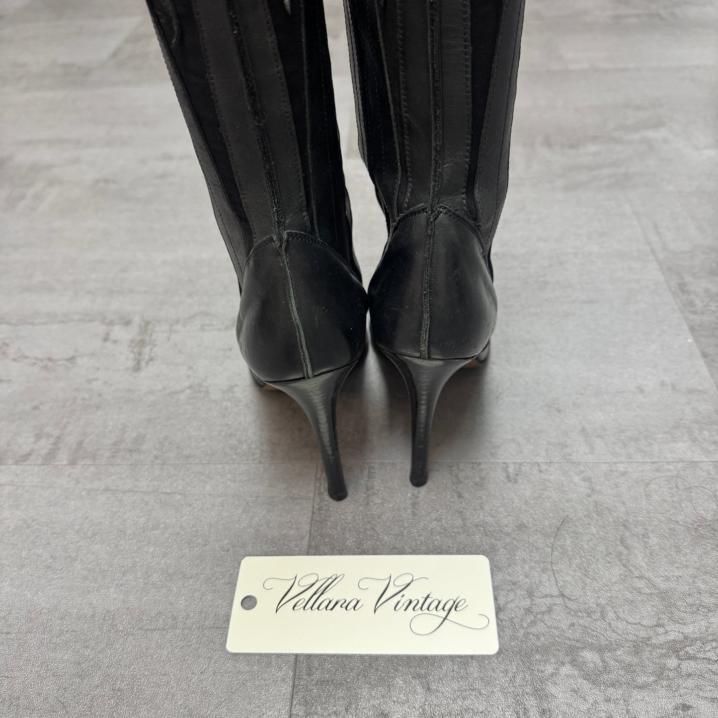 Fluxa Black Leather Paneled Point-Toe Knee High Stiletto Heels